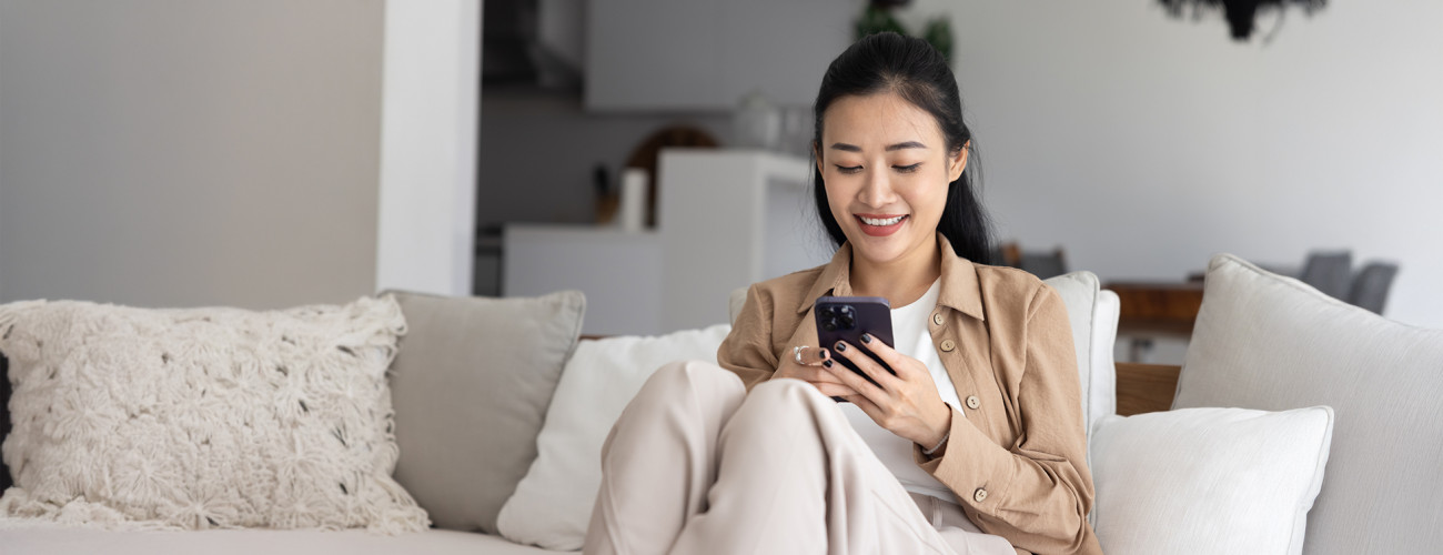 Woman on Sofa with Phone